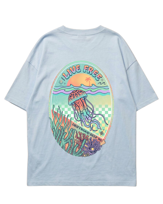 A light blue short-sleeve t-shirt shown from the back, made for female scuba divers, featuring a large, colourful graphic print of a jellyfish in an underwater scene with the text 'LIVE FREE'.
