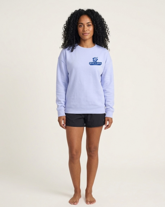 Person wearing a light blue sweatshirt with a logo on a white background