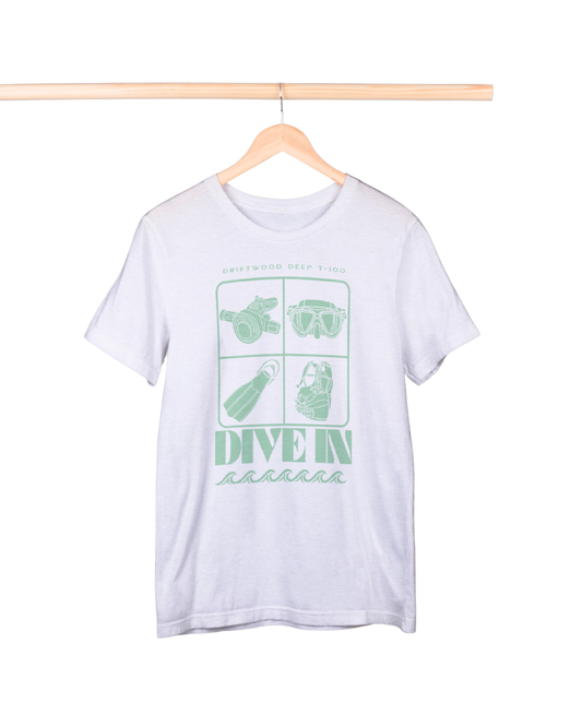 White t-shirt with green graphics and text on a hanger against a white background