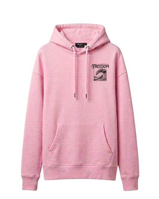 A pink pullover hoodie made for female scuba divers with a kangaroo pocket and drawstrings, featuring a black graphic print on the left chest with the word 'FREEDOM' and a wave illustration, shown against a plain white background.