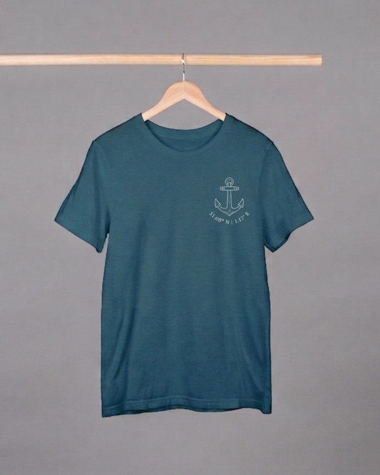 Teal t-shirt with an anchor design on a hanger against a gray background