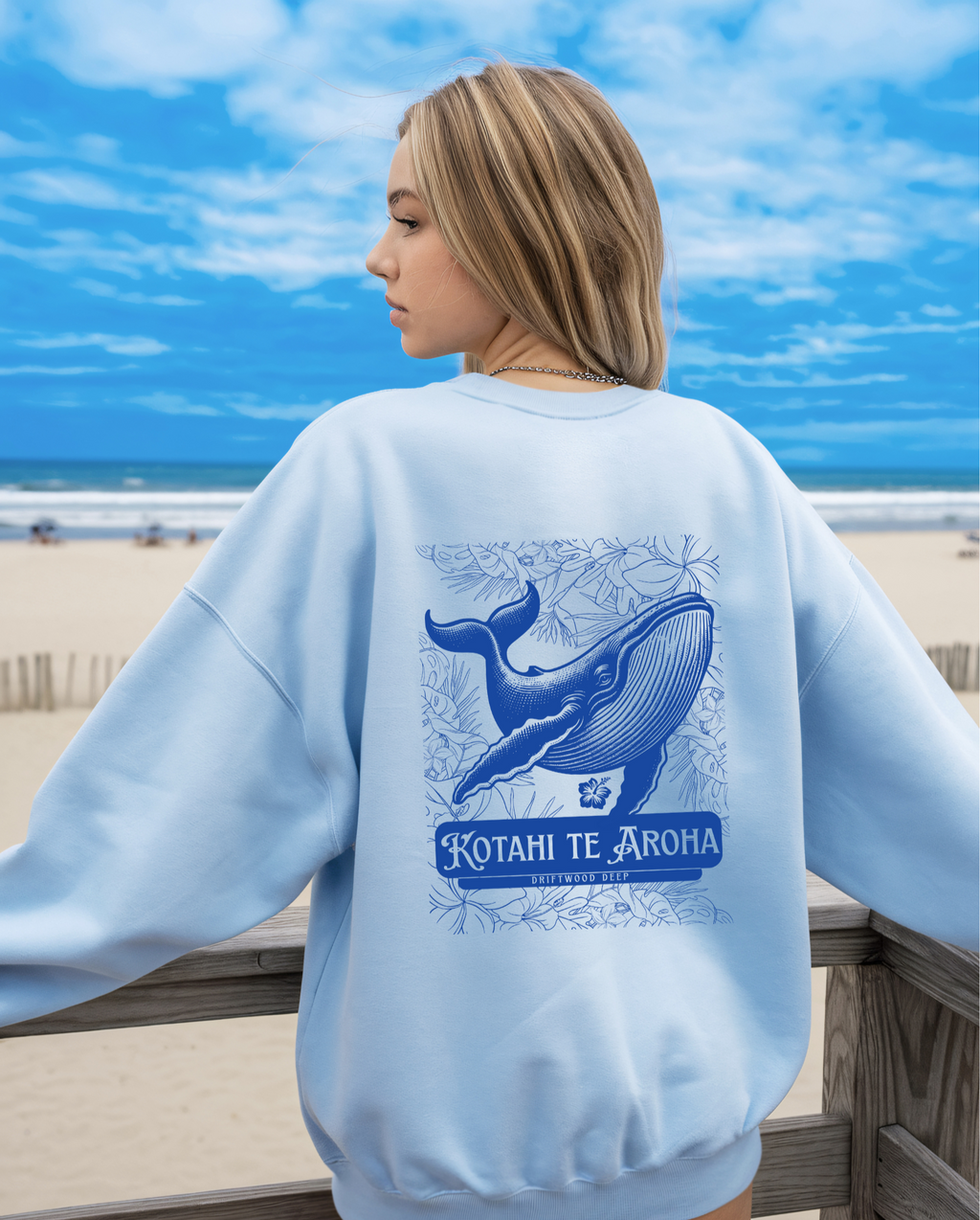 woman wearing a blue sweatshirt