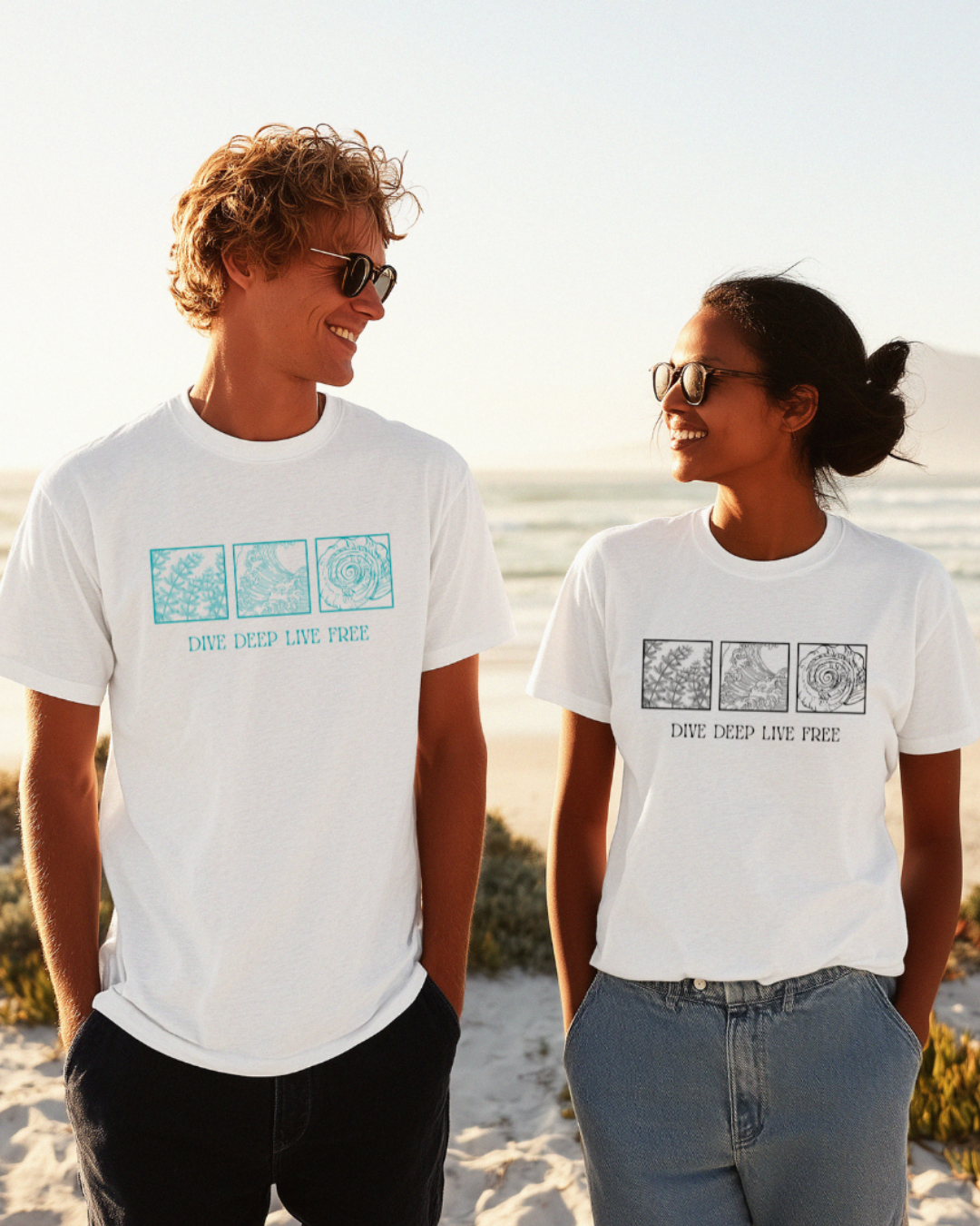 Two people wearing white t-shirts with graphics and text on a beach.