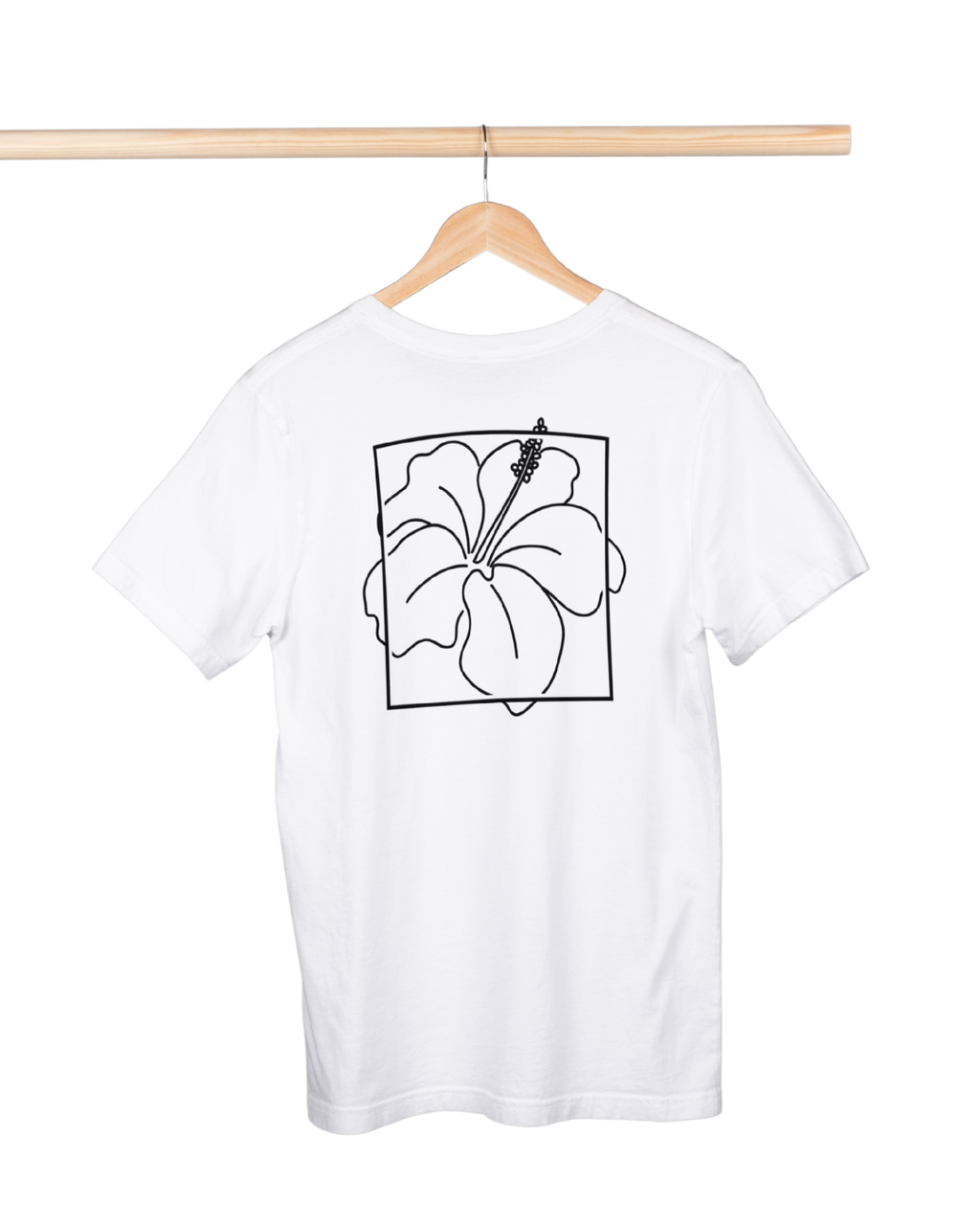 White t-shirt with black floral design on a hanger against a white background