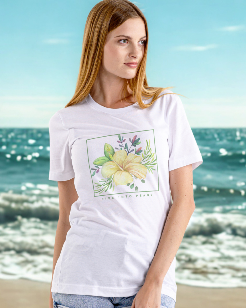 Woman wearing a white t-shirt with a floral design on a beach