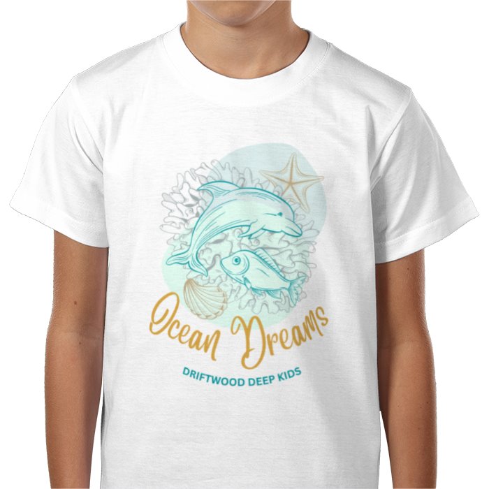 A child wearing a white T-shirt with a graphic print of a whale and accompanying sea life, and the text 'Ocean Dreams DRIFTWOOD DEEP KIDS'.