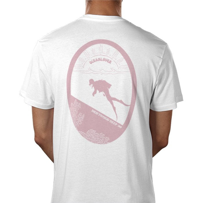 A person wearing a white short-sleeved t-shirt with a rose pink graphic print in the center featuring a scuba diver and underwater scene.