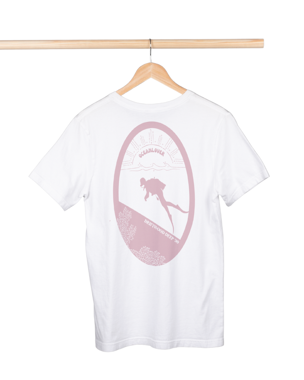 White t-shirt with pink graphic on a hanger against a white background