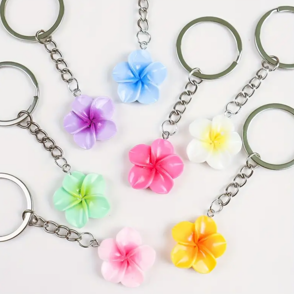 Keychains with colourful flower charms on a white background