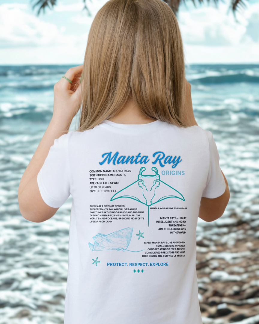 Person wearing a t-shirt with manta ray information on a beach