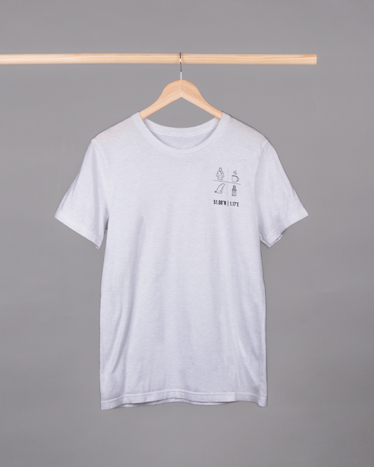 White t-shirt with a small graphic on a hanger against a gray background