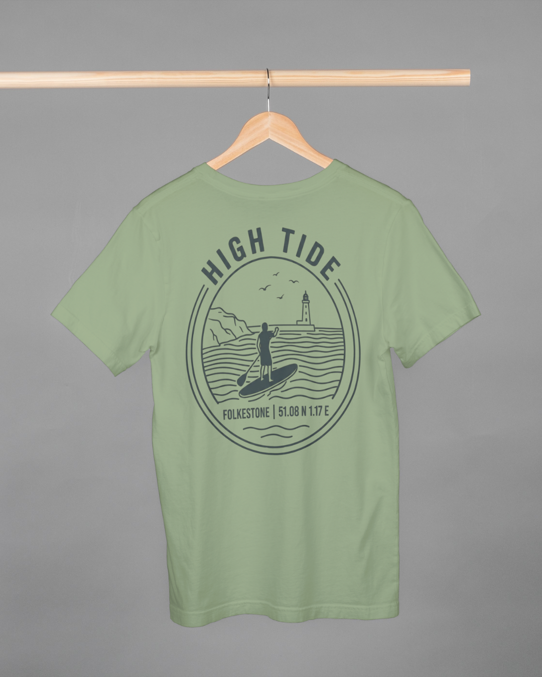 Green t-shirt with 'High Tide' graphic design on a hanger against a gray background