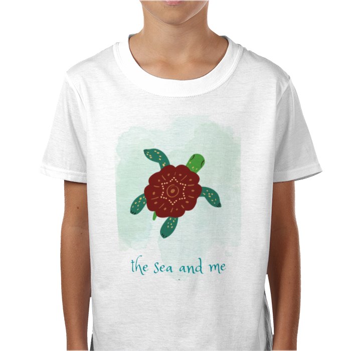 White t-shirt with a turtle design and 'the sea and me' text on a white background