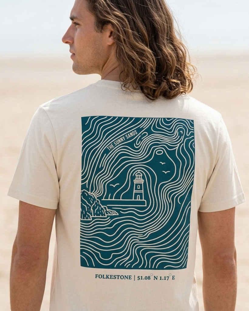 Man wearing a t-shirt with a lighthouse design on a beach