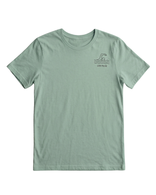 A sage green short-sleeve crewneck t-shirt with a small dark green wave graphic and 'LOW PRESS' text on the left chest, displayed flat against a solid white background.