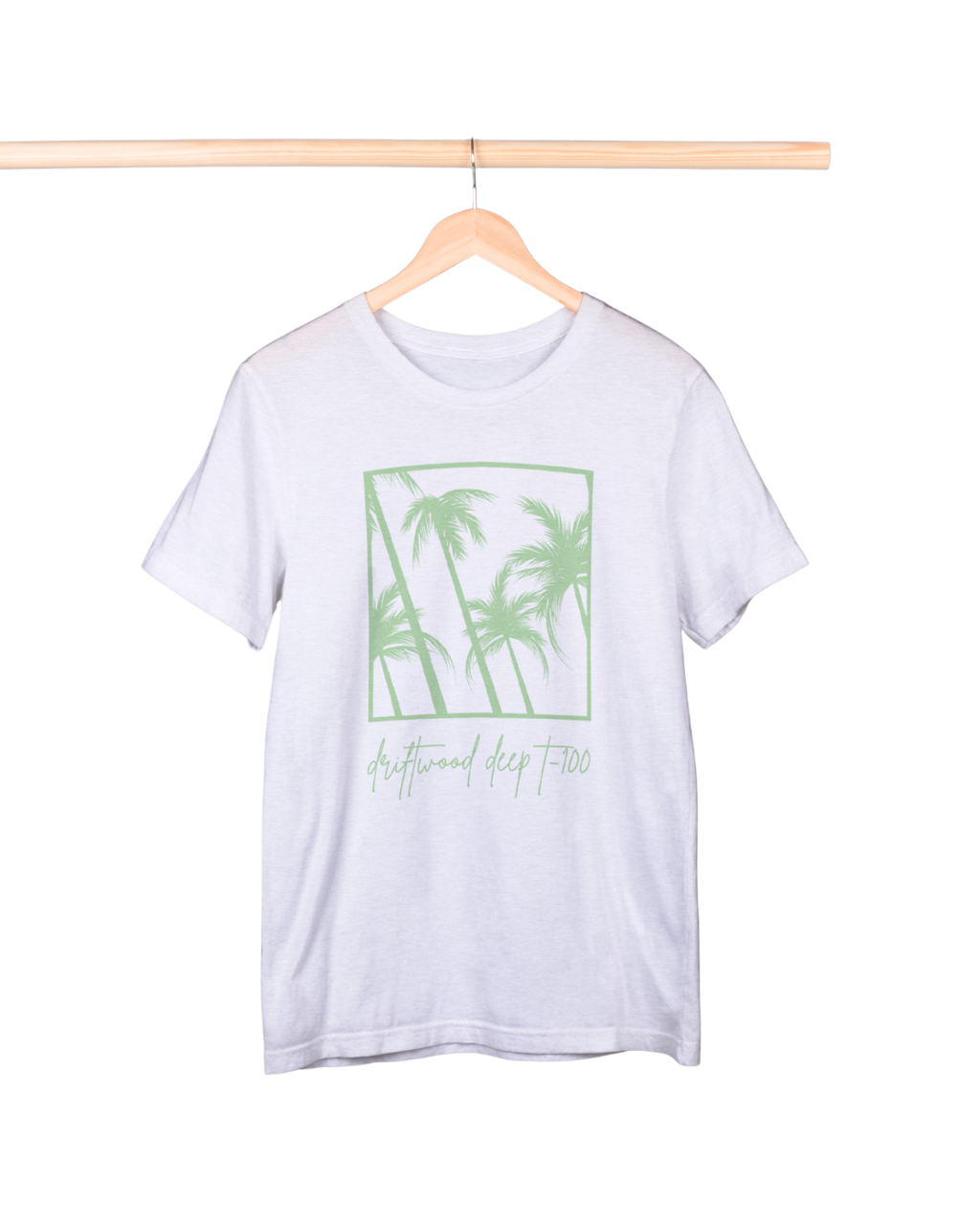White t-shirt with green palm tree design on a hanger against a white background