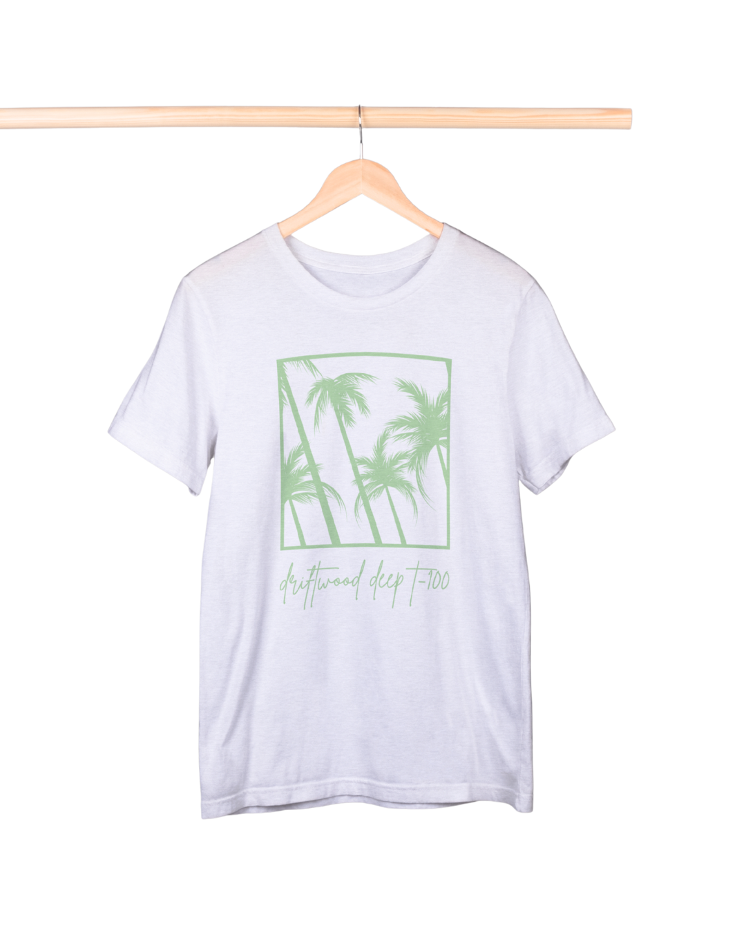 White t-shirt with green palm tree design on a hanger against a white background